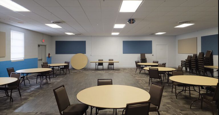 Round tables and chairs set up in the Clubroom at the Lucas County Fairgrounds